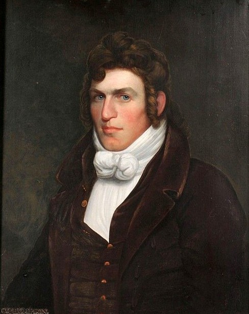 Young Man With Curly Brown Hair And Blue Eyes